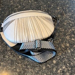 White belt bag with fringe and studded detail